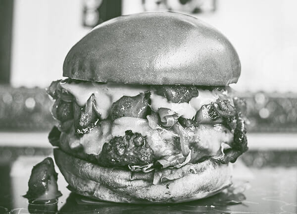 Beef burger with pineapple bacon jam and cheese