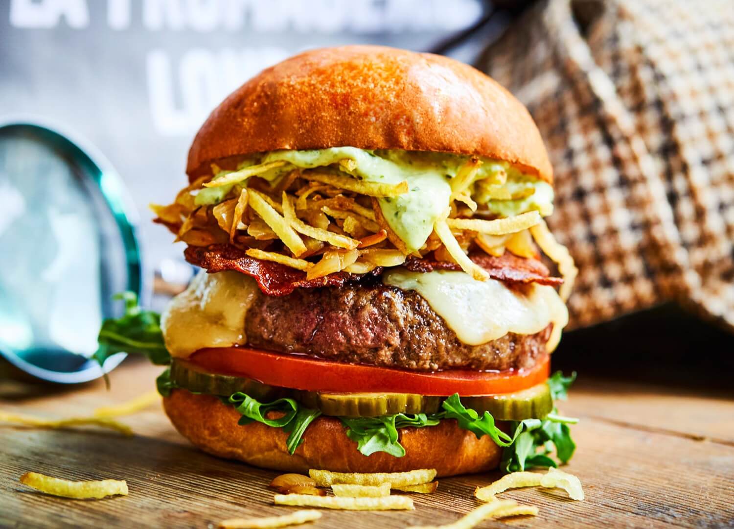 Honest beef burger with pancetta bacon, emmental cheese, caramelised onions and garlic mayo